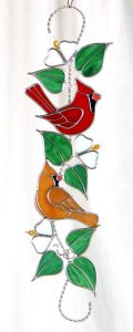Cardinals on a branch scroll